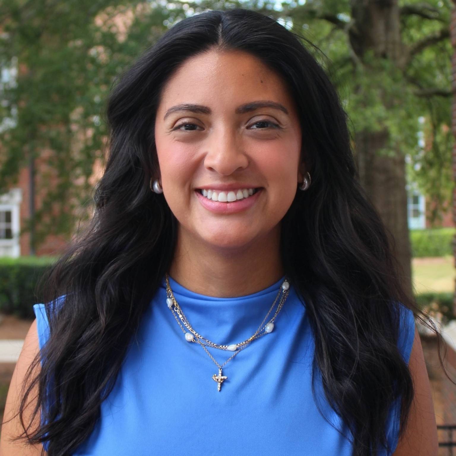 hispanic lady smiling in blue shirt 