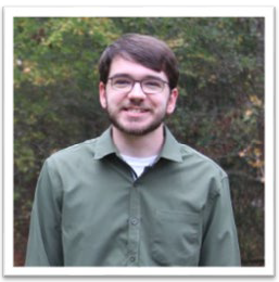 A person wearing glasses and a green shirt