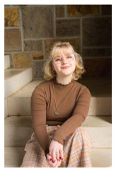 A person sitting on stairs smiling