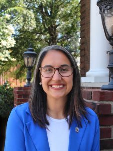 woman smiling with a blue blazer