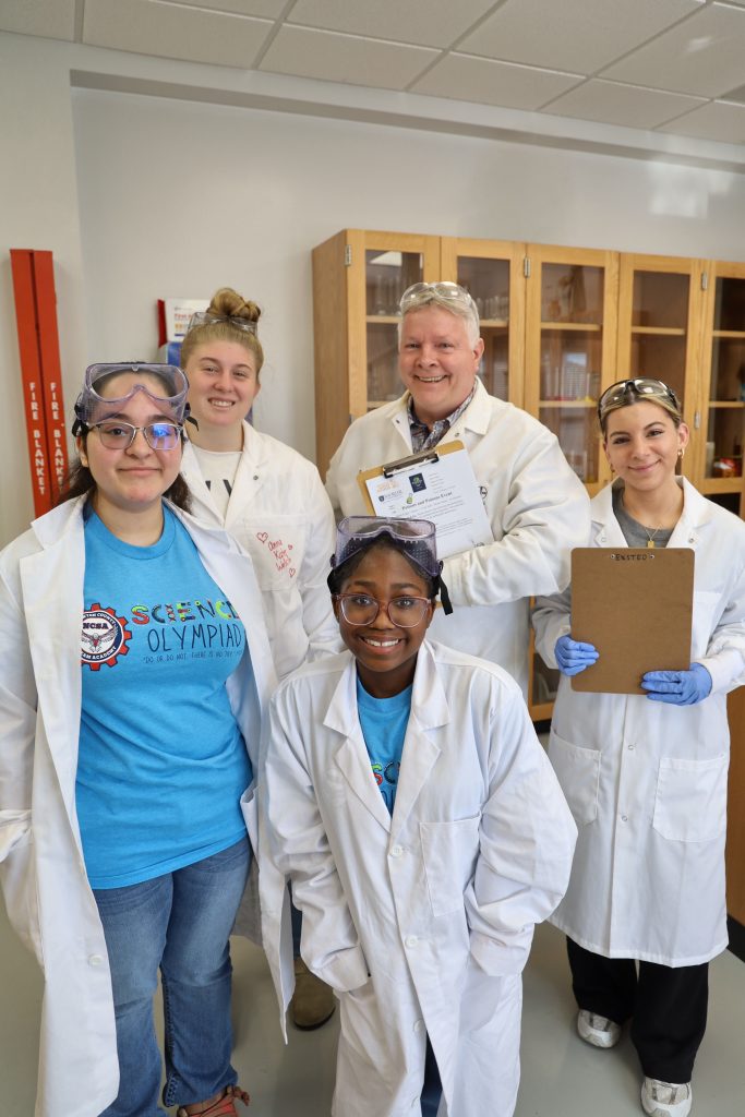 Group of students in lab coats.