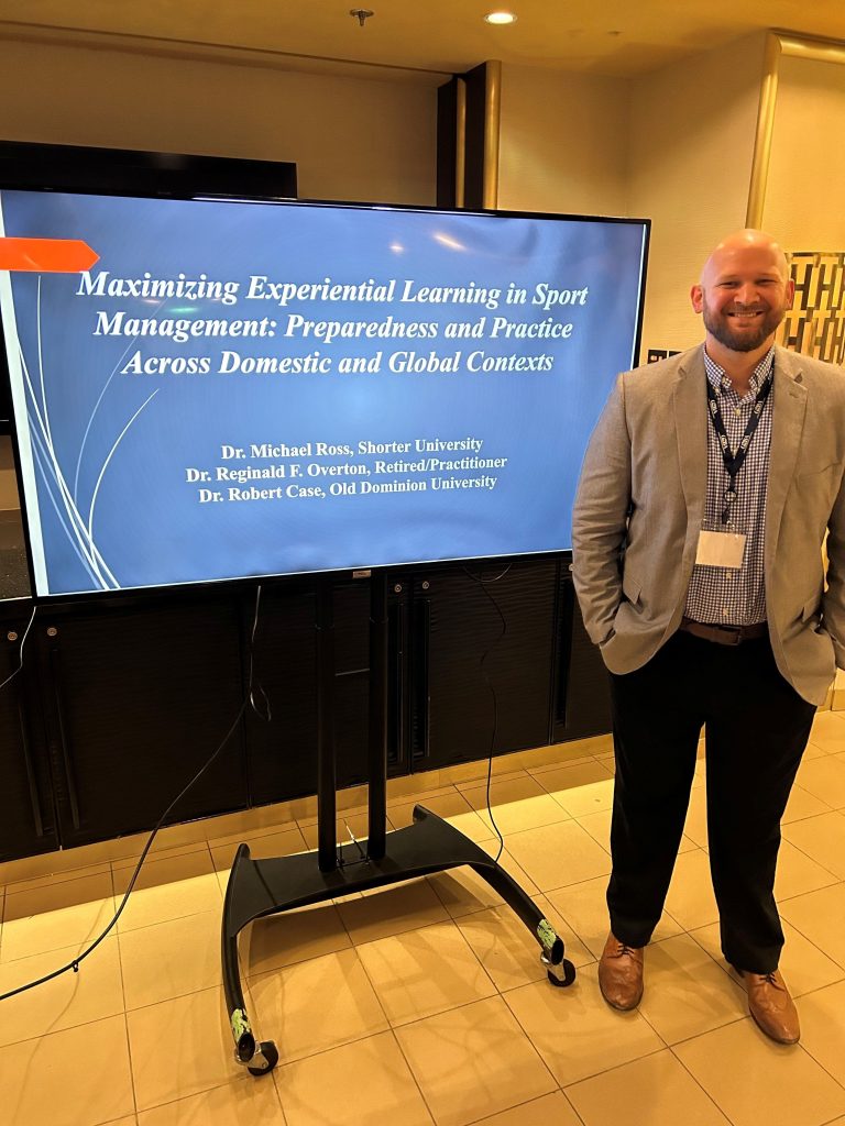 Man standing in front of presentation screen